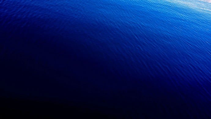 Dark blue gradient evokes the vast sea.